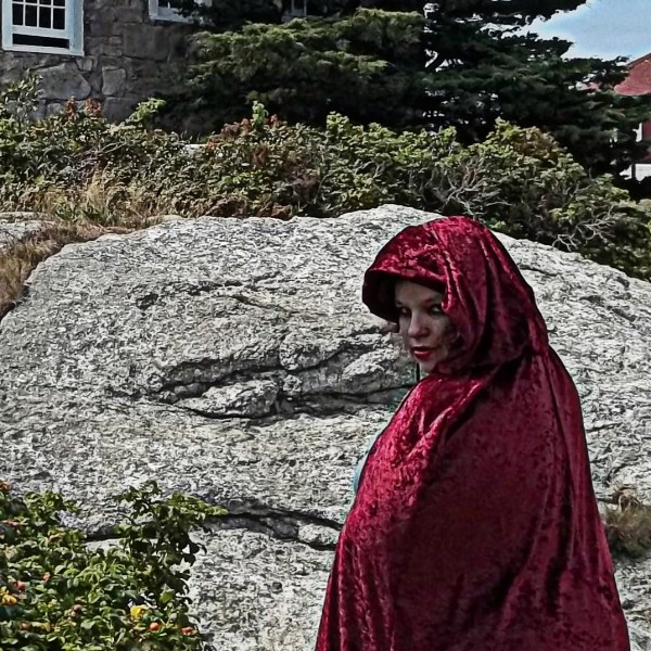 Roxy posing spookily in front of a rock