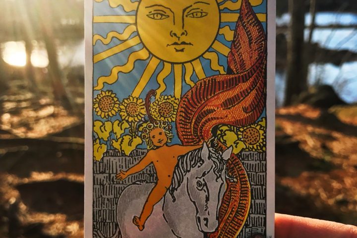 a hand holding up a sign