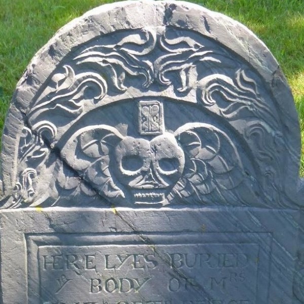 a gravestone in a field